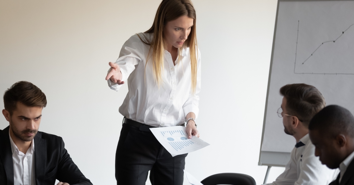 Female boss having conflict during meeting