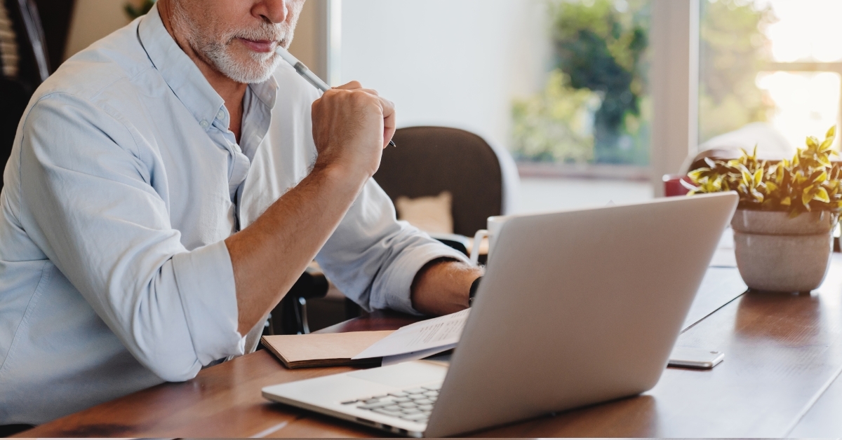 senior businessman working using laptop