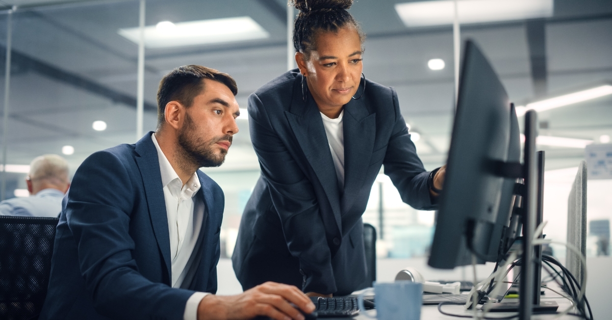 senior manager explaining work to employee