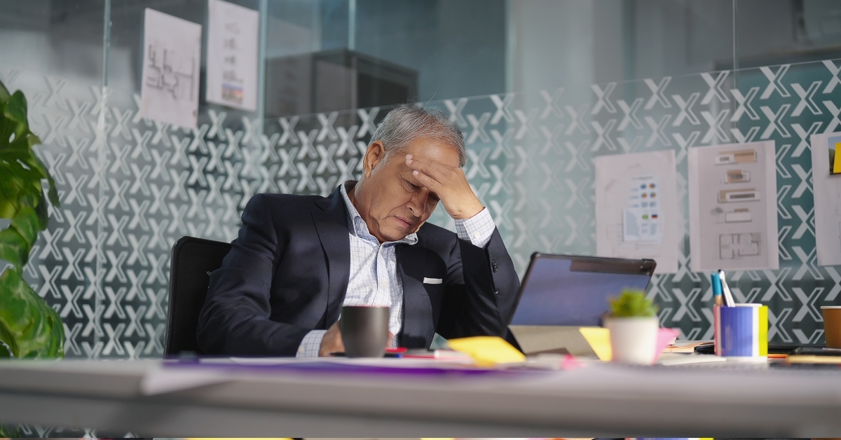 asian manager having headache at work