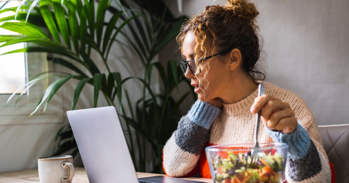 woman working from home having lunch