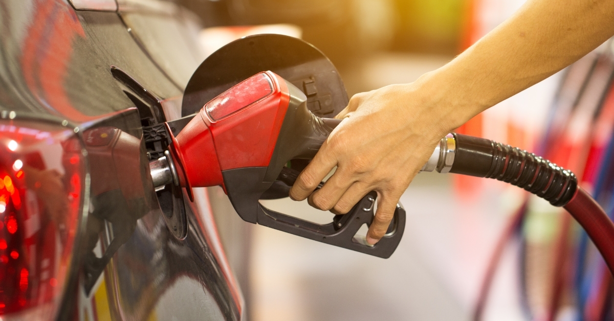 Pumping gas at gas pump