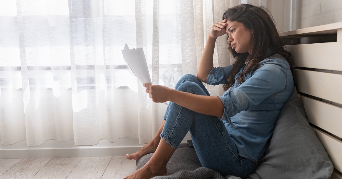 holding financial papers