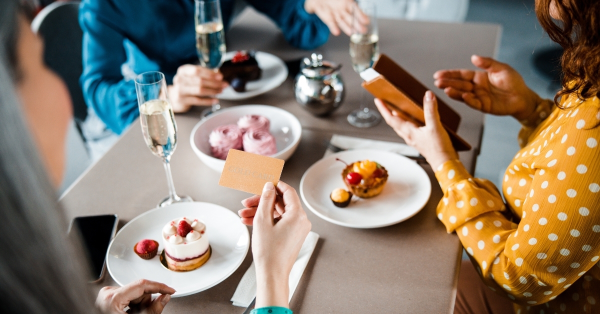 ladies paying for order in cafe