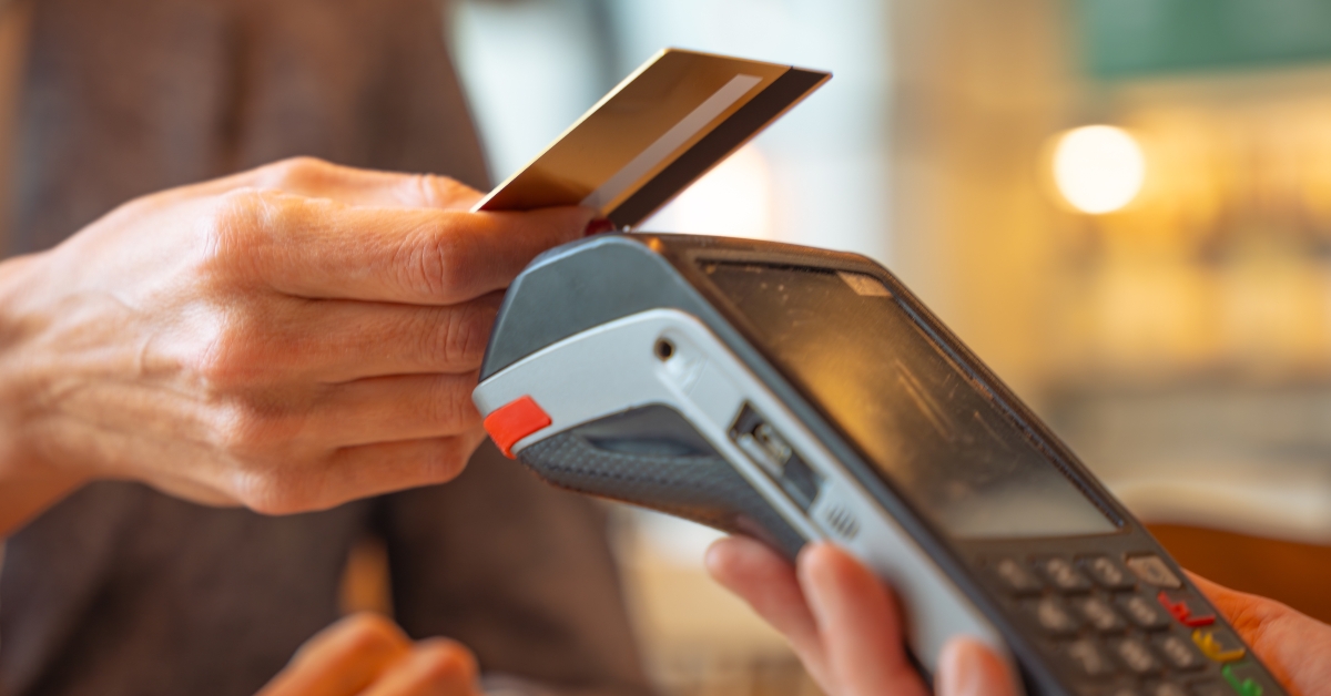 woman paying contactless credit card