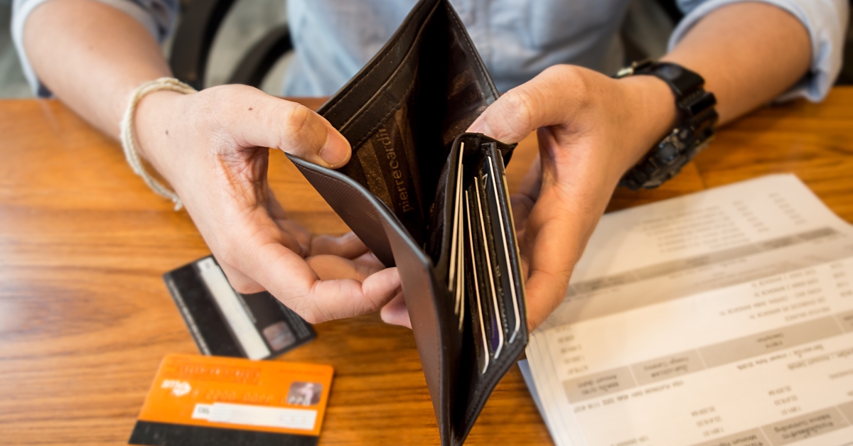 man holding an empty wallet