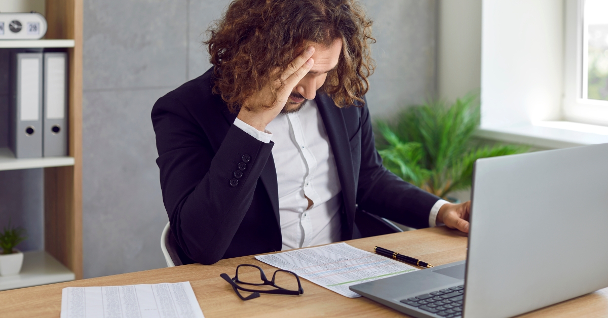 overworked business man in suit