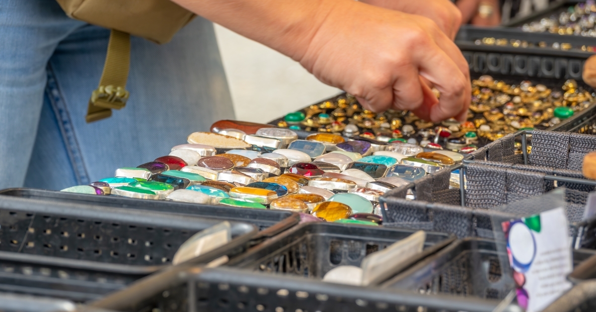 shopper choosing jwellery at flea market