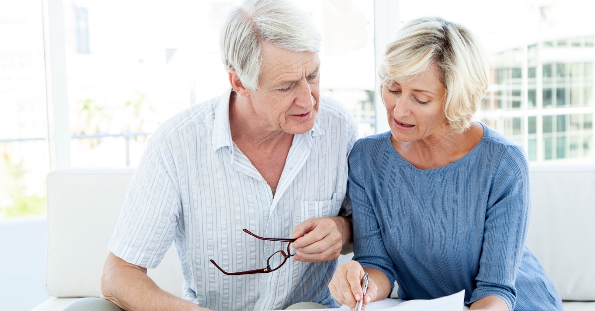 senior couple reviewing finances together