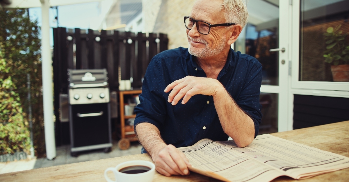 senior man reading a newspaper