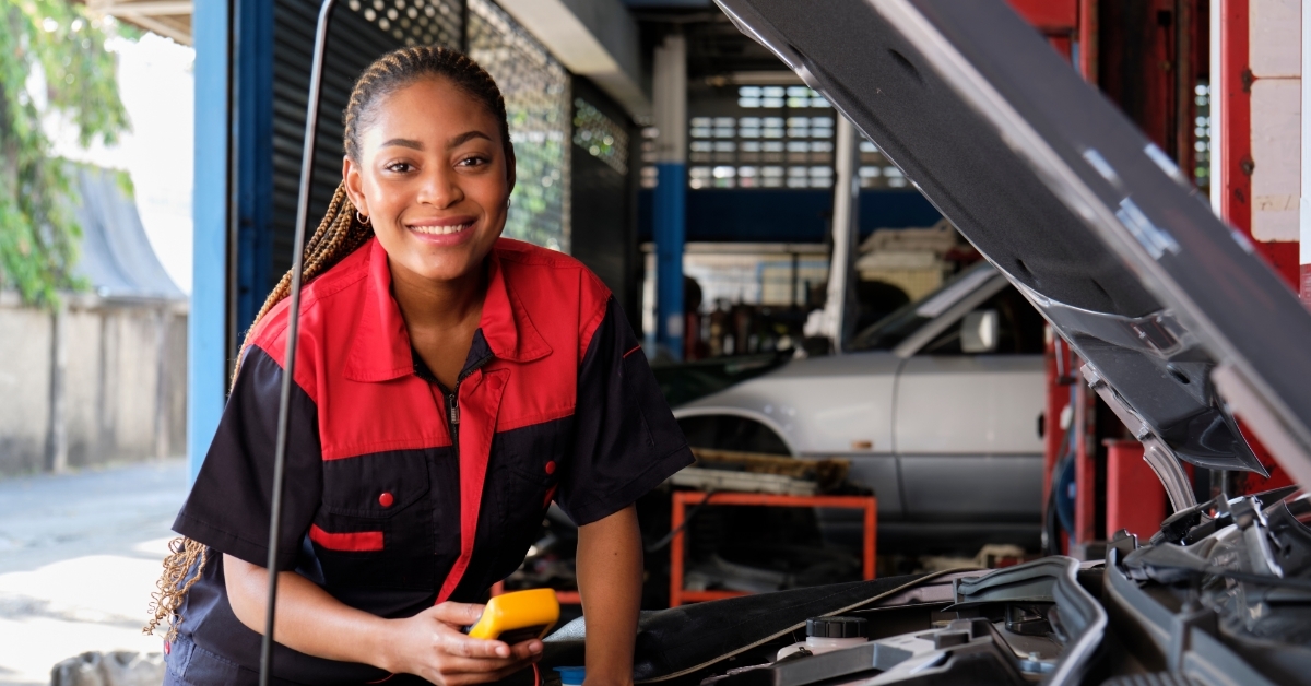 female professional automotive mechanical worker posing