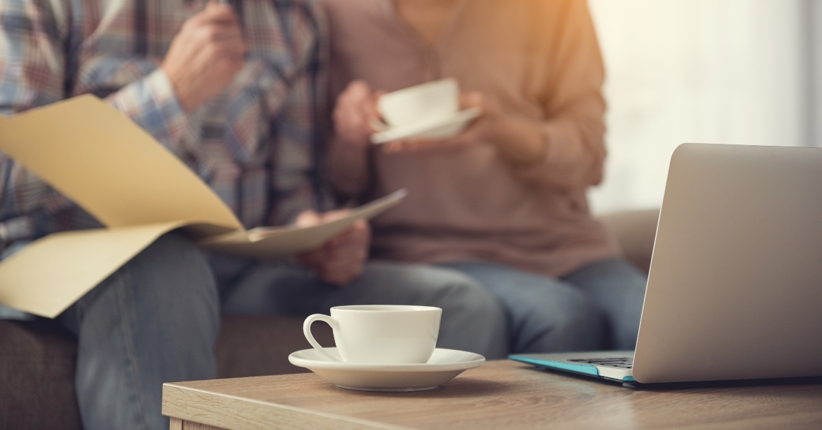 mug and laptop on table