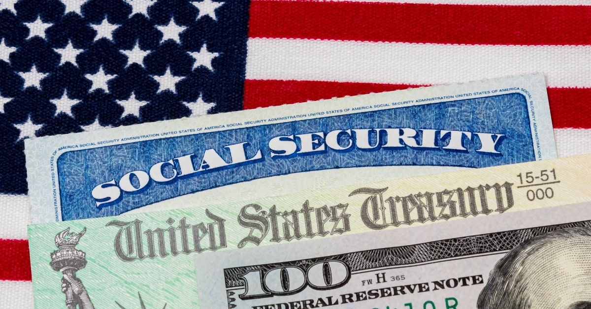 Social security card with 100 dollar bill