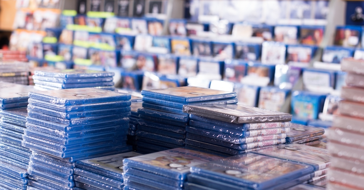 cds and dvds on piles at store