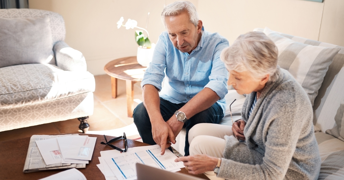 senior couple reviewing investment policy together