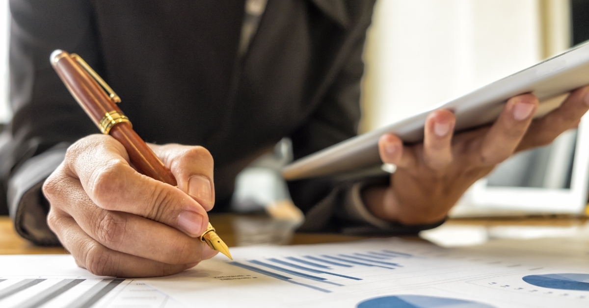 Business women analyzing charts in meeting room