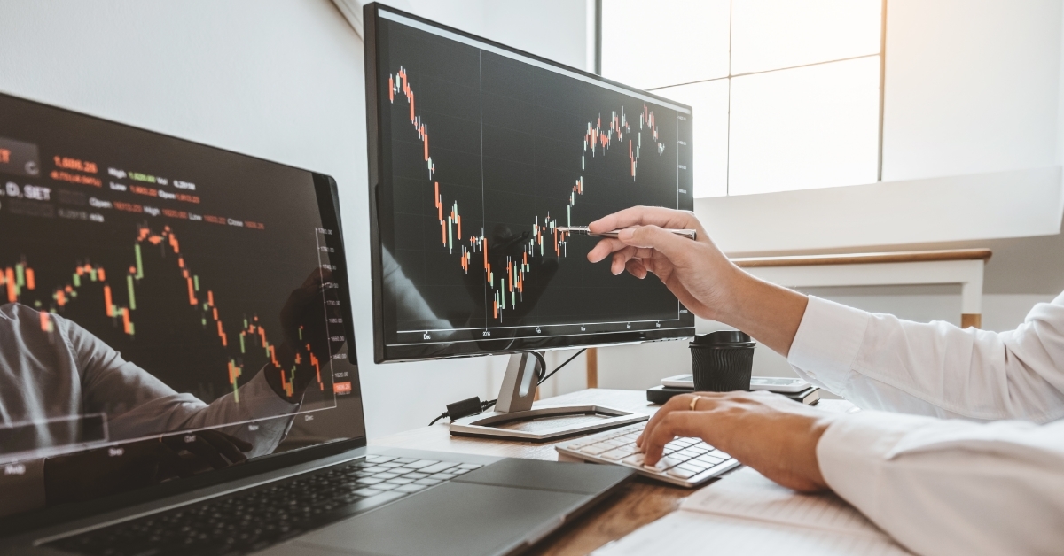 businessman analyzing stock market graphs