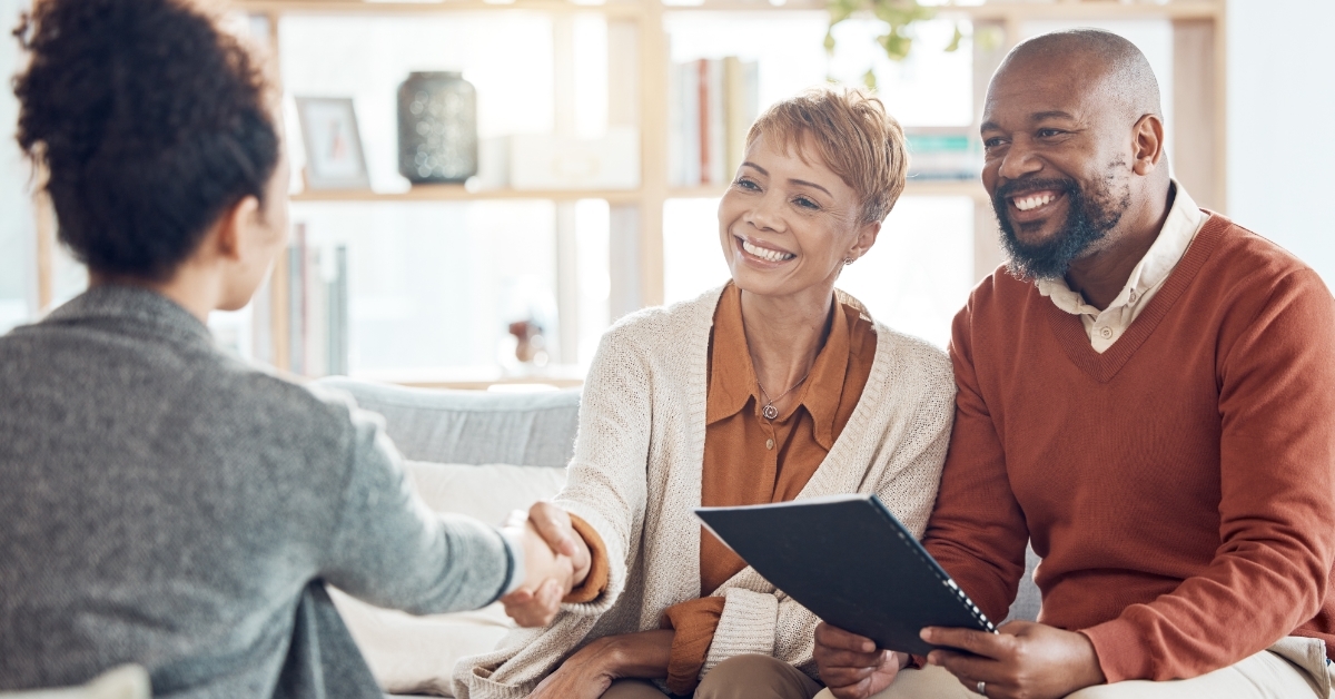 couple planning insurance policy with advisor