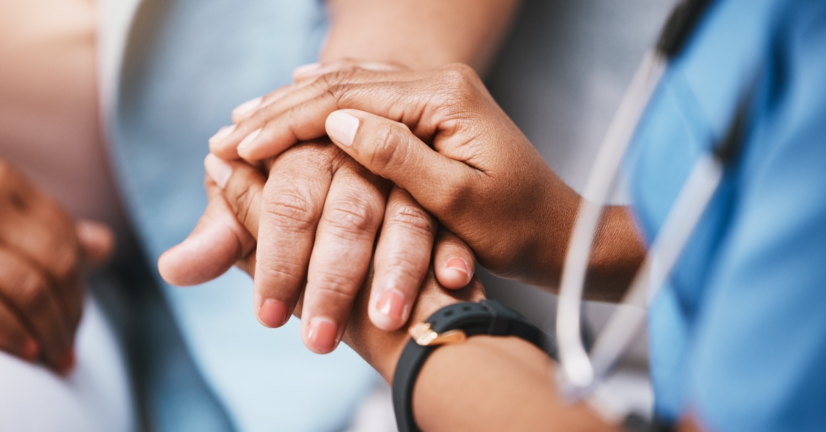 nurse holding hands with patient