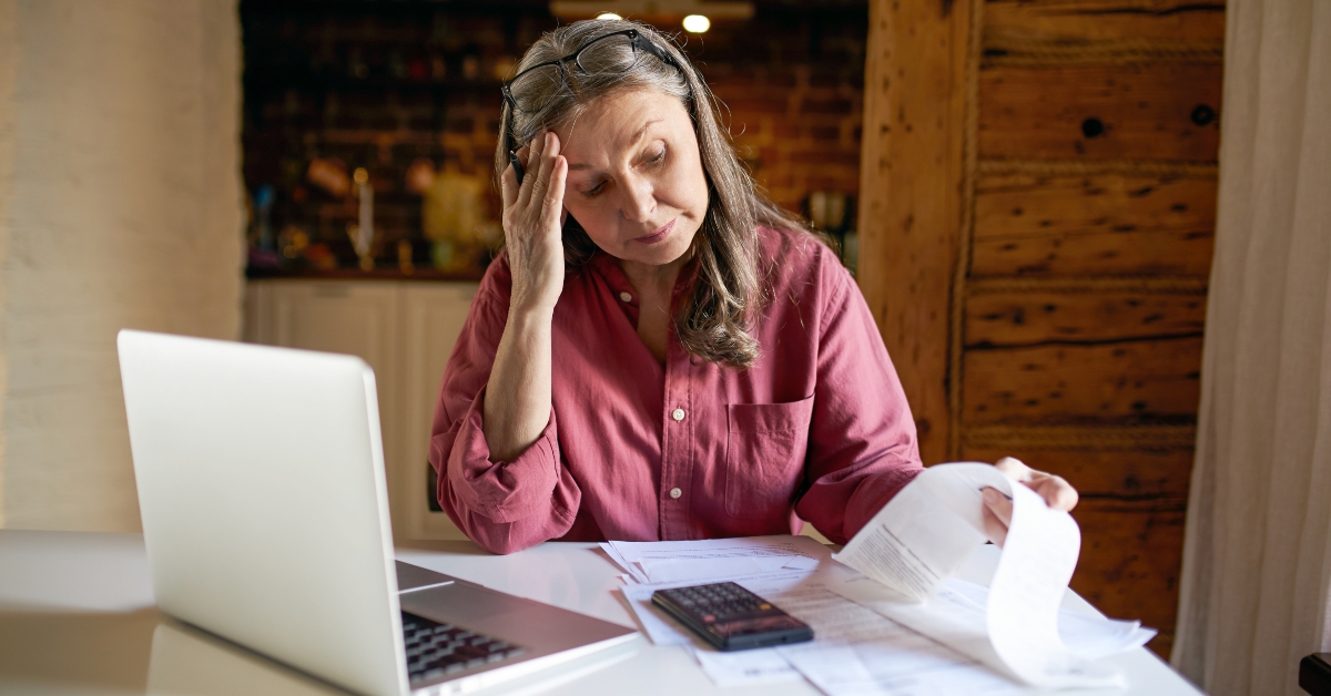 Retired woman sitting at table