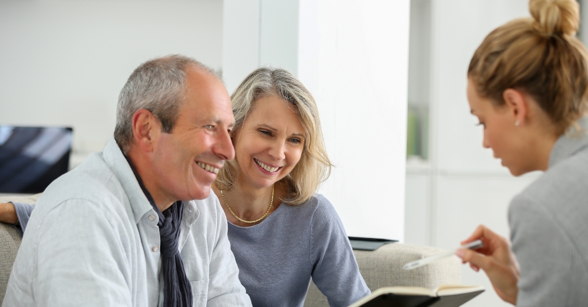 agent selling life insurance to senior couple