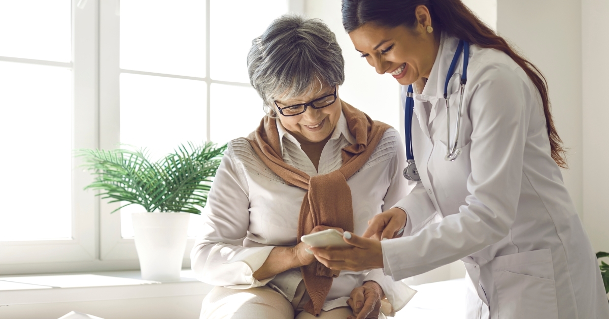 doctor showing mobile healthcare app to patient