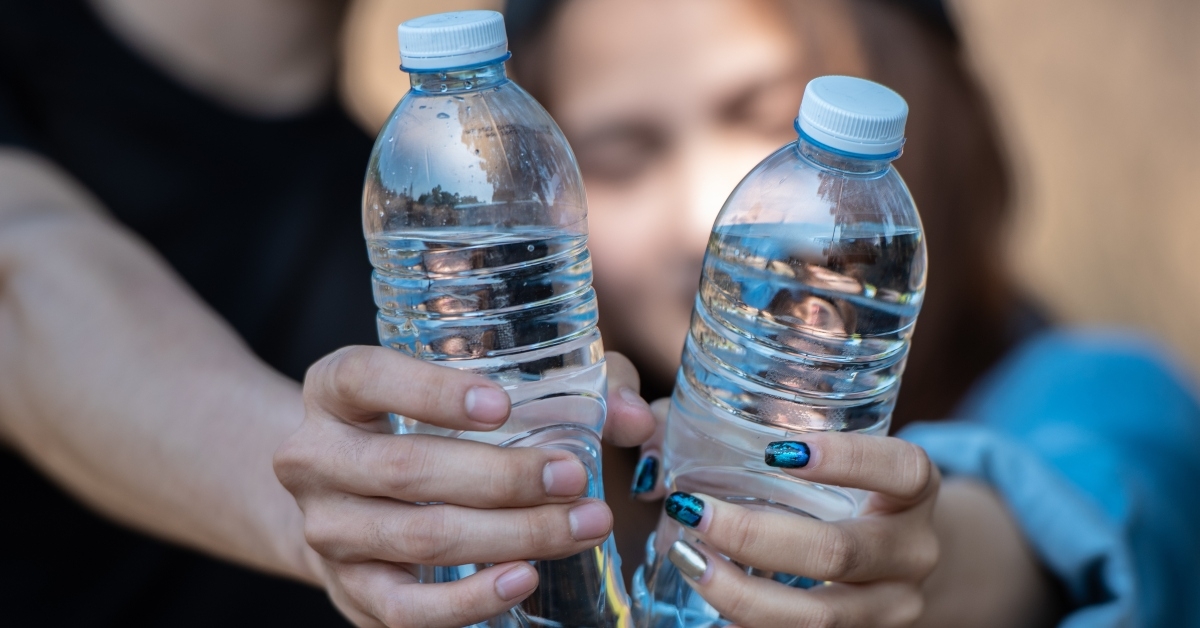 holding water bottles