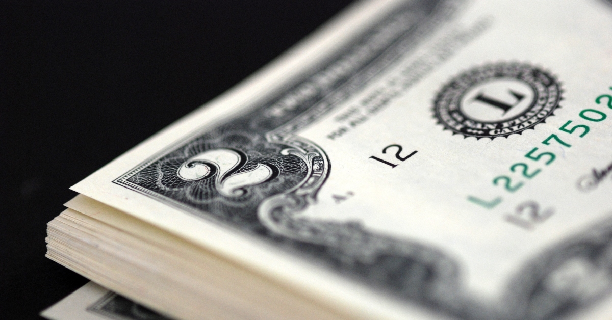 stacks of two dollar bills on black