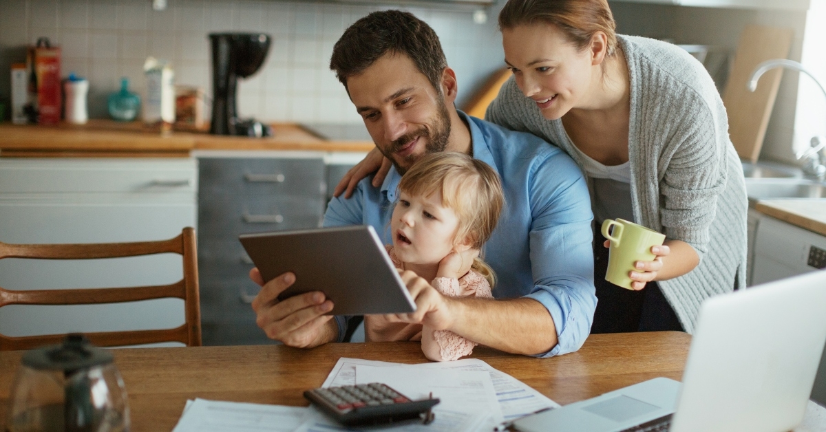 young family using tablet