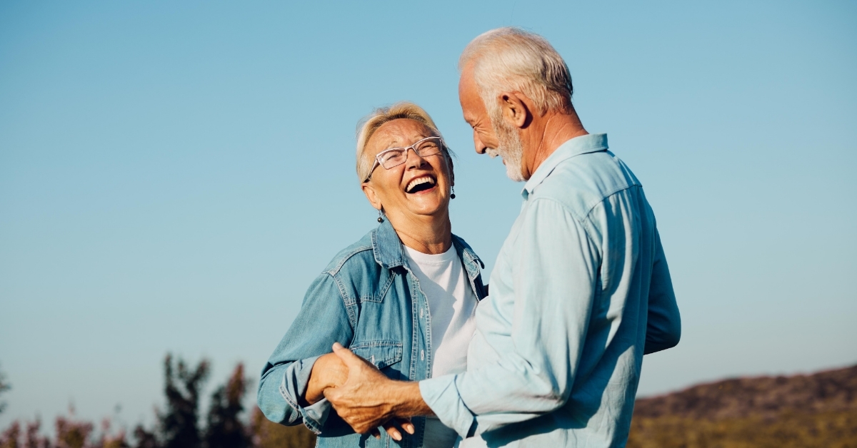happy senior couple enjoying outdoors