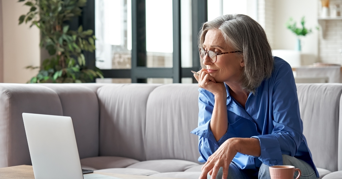 senior woman working from home using laptop