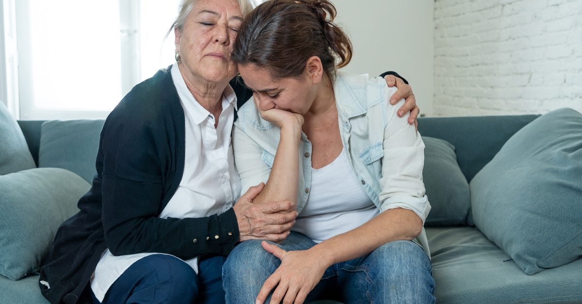 Mother and daughter crying