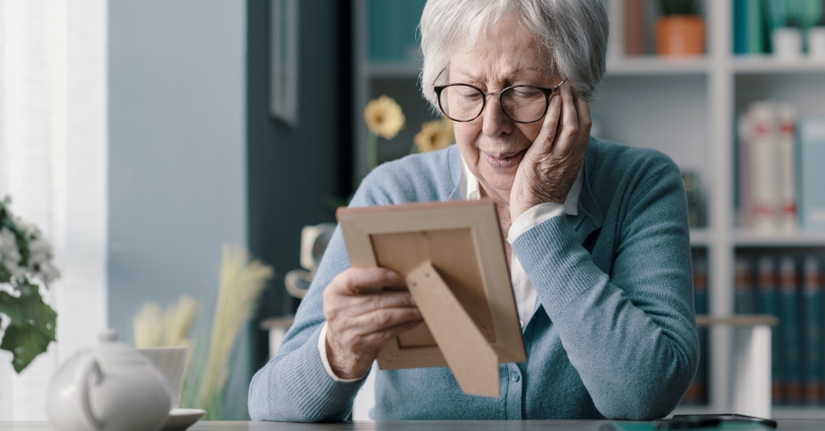 Sad old woman mourning