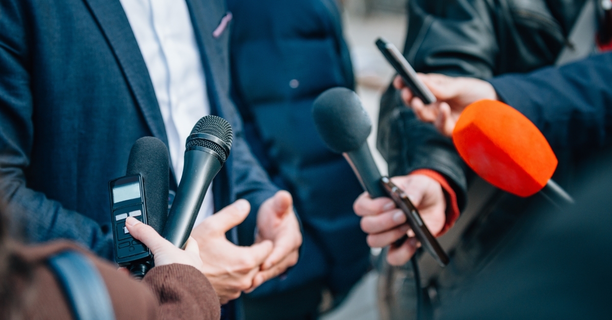 reporters Interviewing politician on press conference