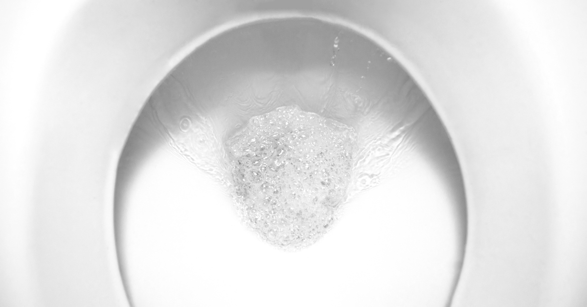 flushing water in the toilet