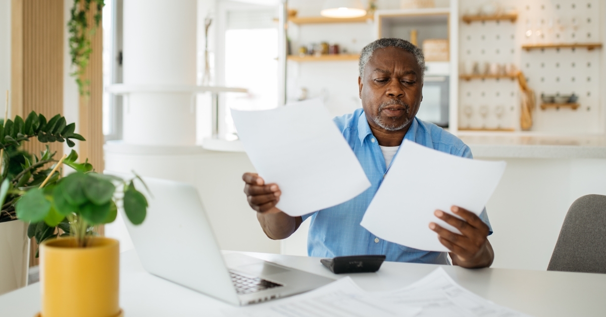 african american retired man reviewing taxes