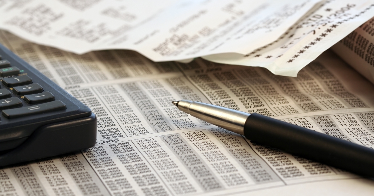 calculator and pen on tax form