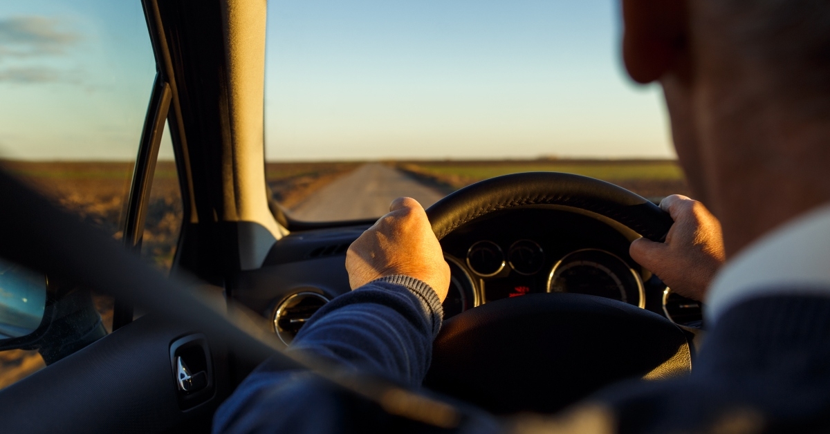 holding steering wheel