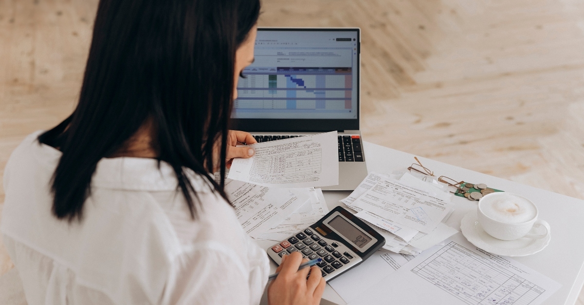 woman calculates utility expenses 