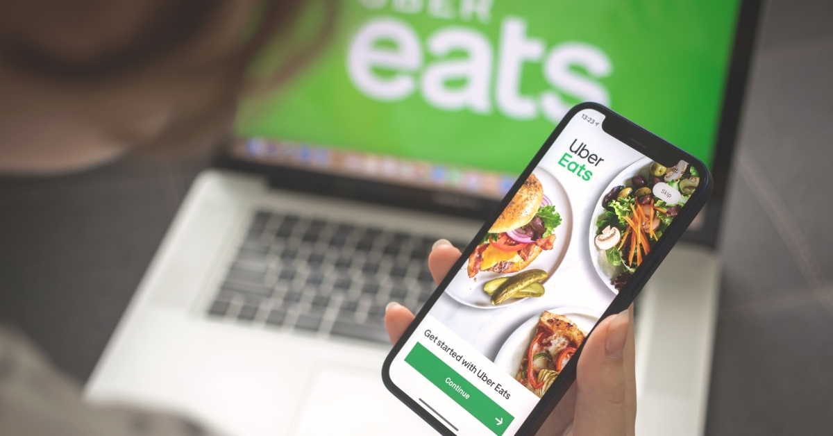 Woman using Uber Eats application
