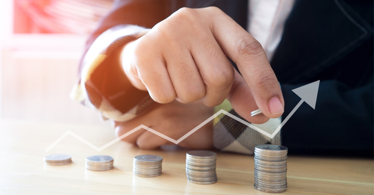 Woman putting coins on stack