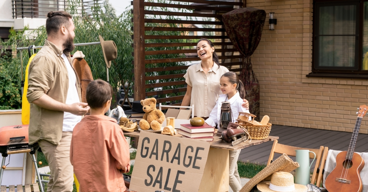 mother daughter selling toys at garage sale