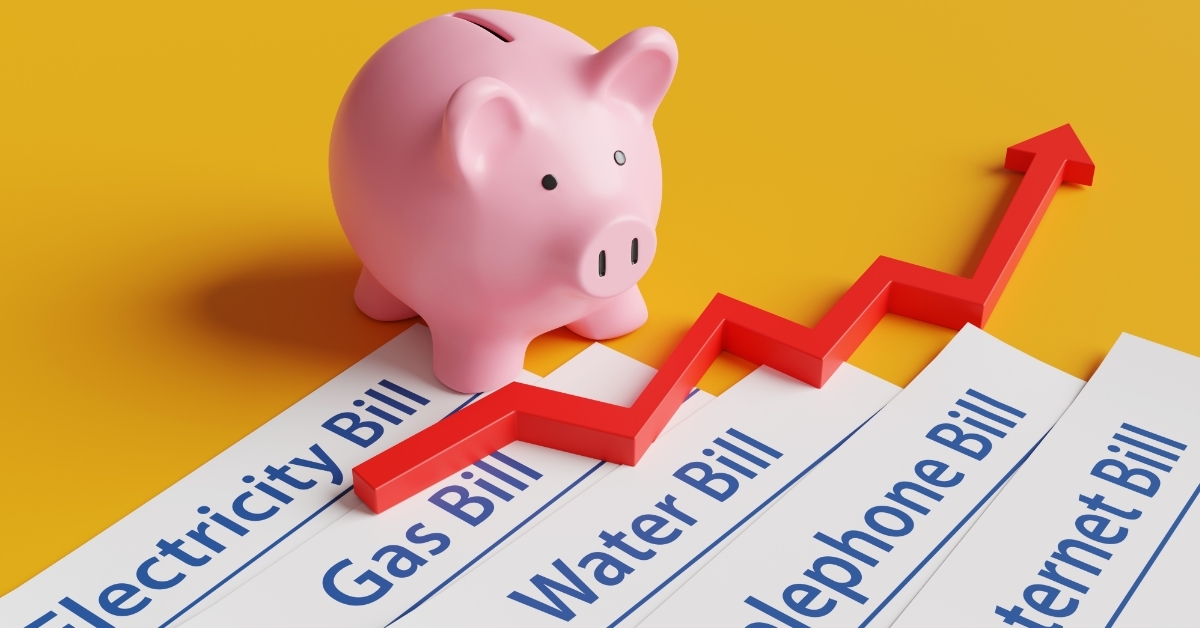 piggy bank over bills household expenses concept