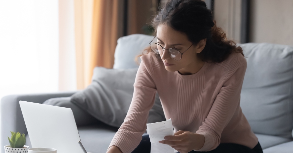 woman calculating bills at home