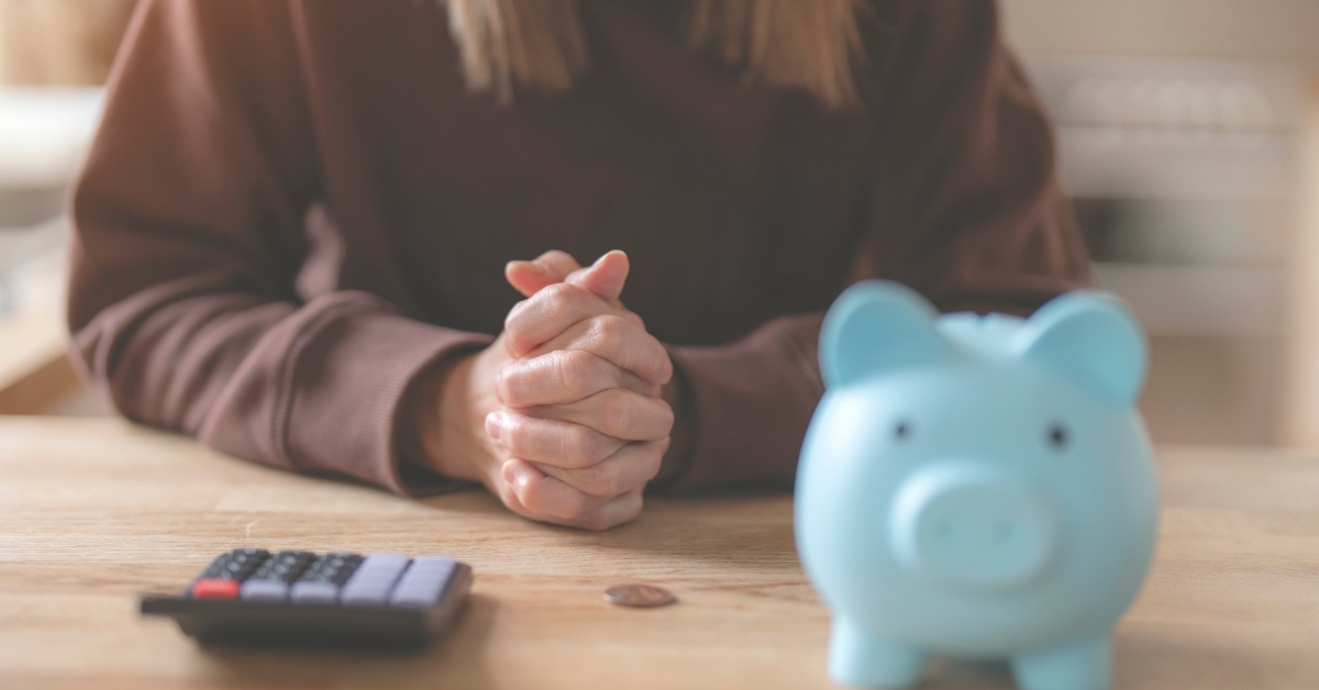 woman with calculator planning expenses