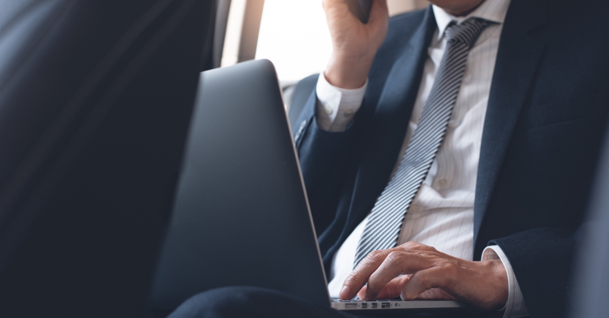 working on laptop inside a car