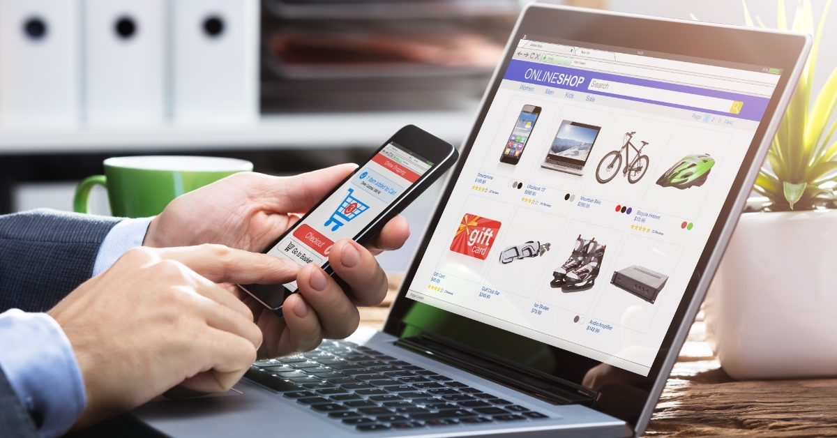 businessman shopping online using smartphone and laptop