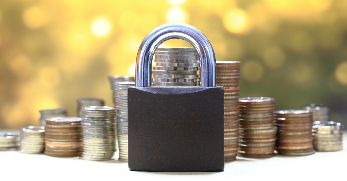 Coin stack and lock financial security concept