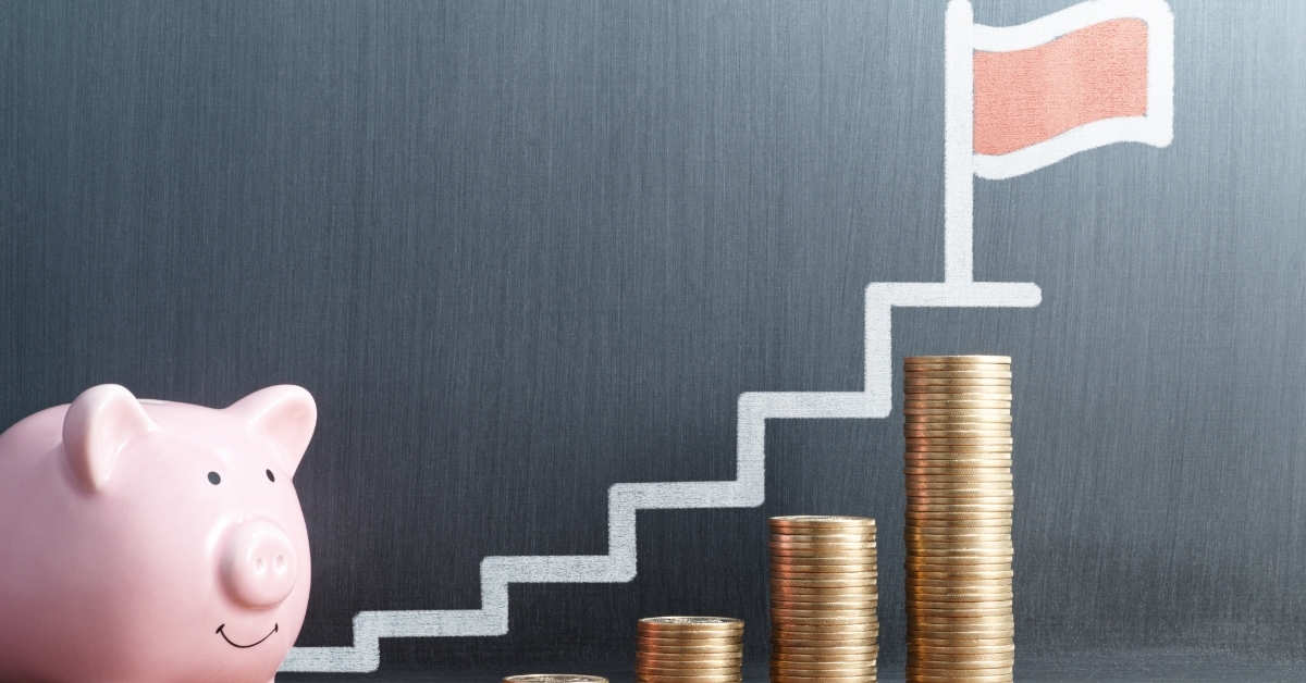 coins stack and piggy bank saving concept