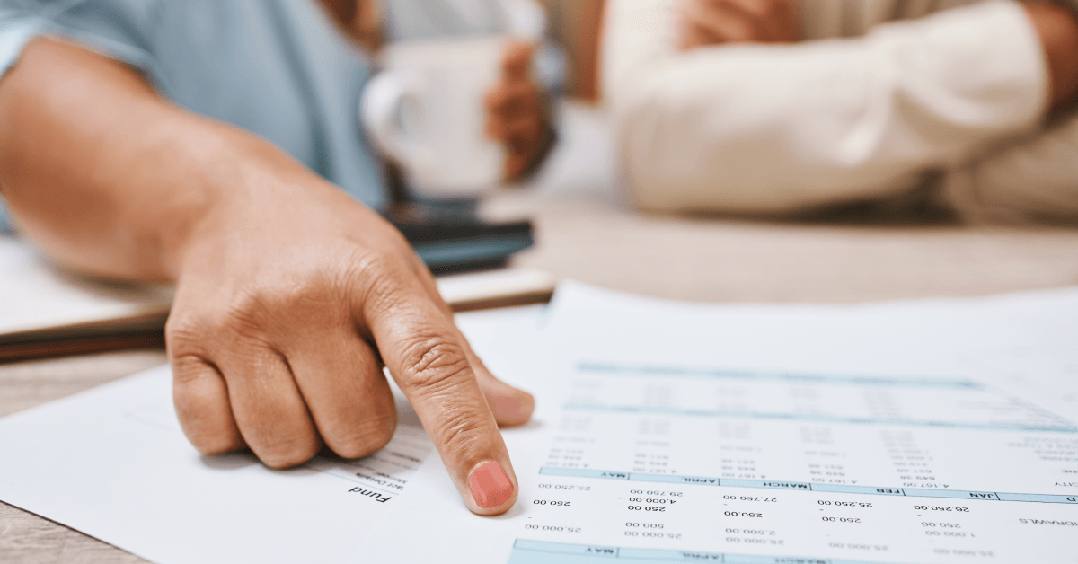 Senior hands looking at budget